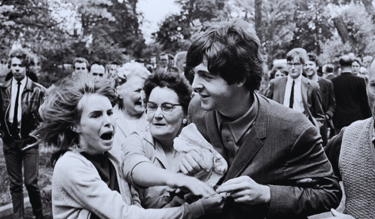 Paul McCartney with a herd of fans